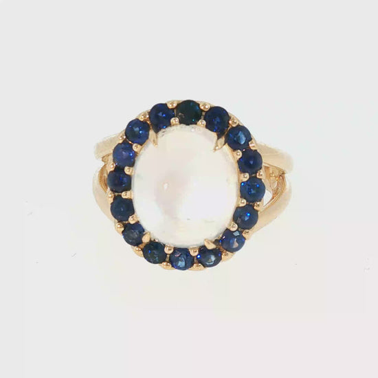 Video of moonstone and sapphire halo ring in 14kt yellow gold